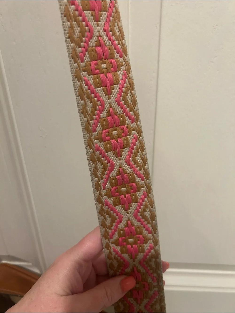 Tan Crossbody Camera Bag with Pink Patterned Strap and Tassel